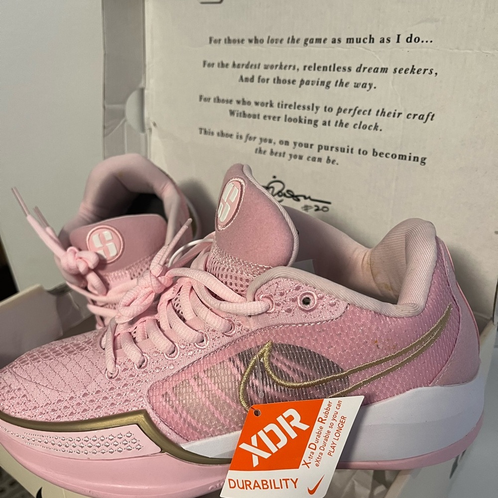 Women's size 5 powder pink Sabrina Ionescu basketball shoes.
